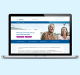 Laptopbildschirm zeigt Webseite von Haus & Grund mit Angebot zum sicheren Online-Kauf von Mietverträgen und Formularen, darunter zwei Buttons und ein Bild von zwei Personen